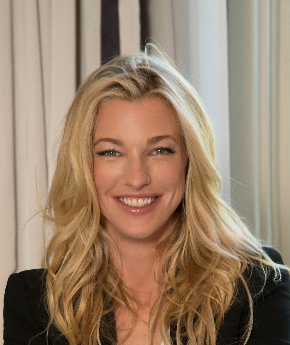 Nicole Junkermann smiling warmly in soft daylight